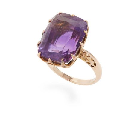 An amethyst cocktail ring  Collet-set with a cushion-cut amethyst, pierced detail to gallery and shoulders, unmarked  Dimensi
