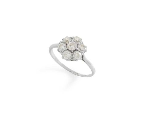A diamond cluster ring Claw-set with seven old round-cut diamonds, stamped PLATDimensions:Ring size: P/O