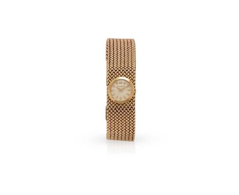 Jaeger LeCoultre: A mid century wristwatch Round dial with baton indicators, rear wind, set into a woven integral bracelet, f