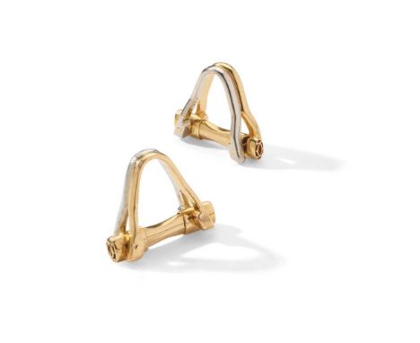 Cartier: A pair of bi-coloured cufflinks Of bi-coloured stirrup design, with double-C finials, signed Cartier, numbered, Fren