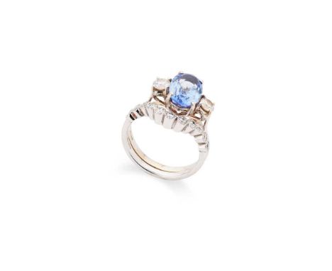 A sapphire and diamond three-stone ring and matching band Claw-set with an oval-cut sapphire, weighing approximately 3.00cts,