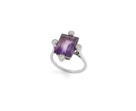 An amethyst and diamond ring Claw-set with a rectangular step-cut amethyst, millegrain-set with four round-cut diamonds, unma