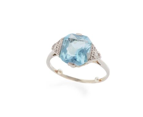 An aquamarine and diamond ring Claw-set with an octagonal-cut aquamarine, each shoulder set with eight-cut diamonds, unmarked