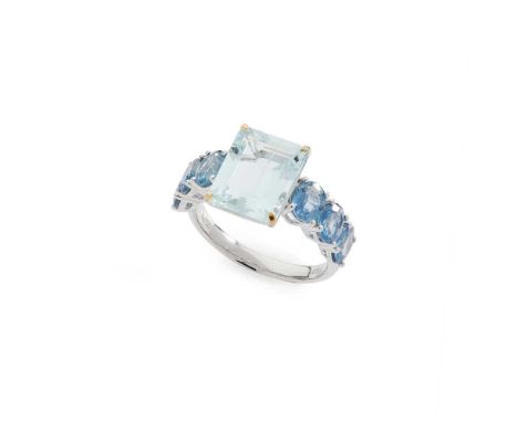 An aquamarine and sapphire ring Claw-set with a cut-cornered rectangular step-cut aquamarine and six oval-cut sapphires, stam