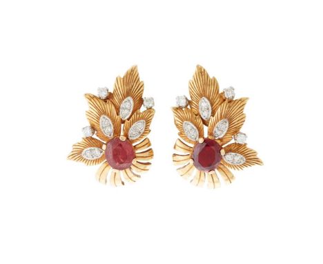 A pair of ruby and diamond floral earrings Each claw-set with an oval-cut ruby and small eight-cut diamonds, clip fittings, m