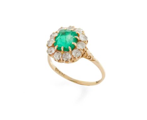 An emerald and diamond ring Claw-set with a cushion-cut emerald in a border of old round-cut diamonds, indistinctly markedDim