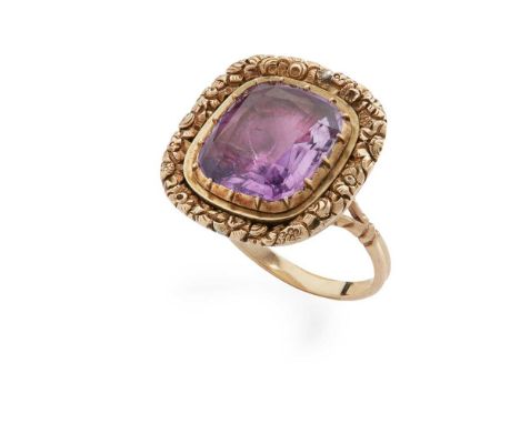 A foil-backed amethyst dress ring Set with a foil-blacked cushion-cut amethyst in a cast foliate border, unmarkedDimensions:R