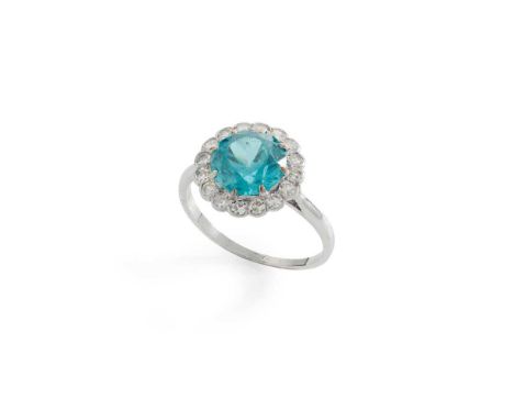 A blue zircon and diamond cluster ring Claw-set with a round-cut blue zircon in a surround of round eight-cut diamonds, stamp