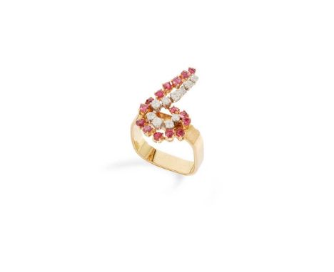 A ruby and diamond dress ring Claw-set with a scrolling motif of graduated round-cut rubies and diamonds, to a square band, m