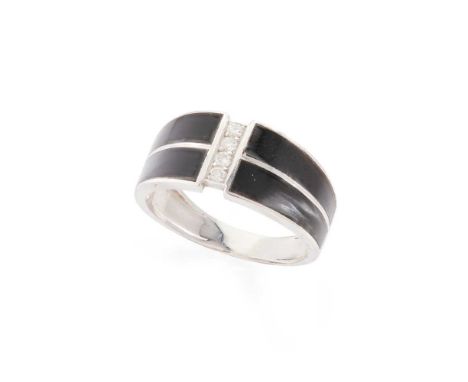 A French enamel and diamond ring The iridescent black enamel detail with a central row of four round brilliant-cut diamonds, 
