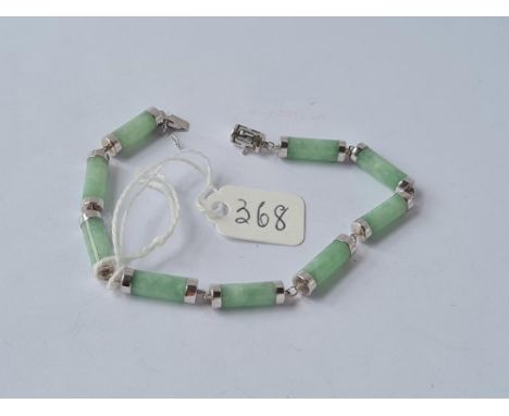 A 9 cylinder panel jade bracelet set in 14ct white gold