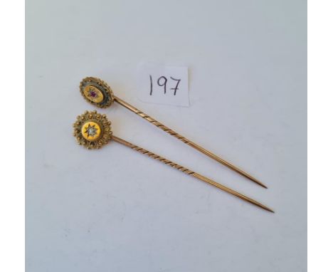 Two 15ct gold top stick pins one diamond set