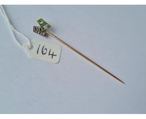 A vintage stick pin with initialled PA in diamonds &amp; emerald stones in gold unmarked