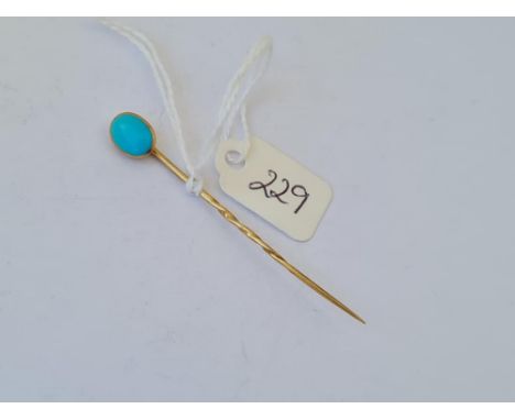 An unusual turquoise and gold stick pin opening to concealed locket