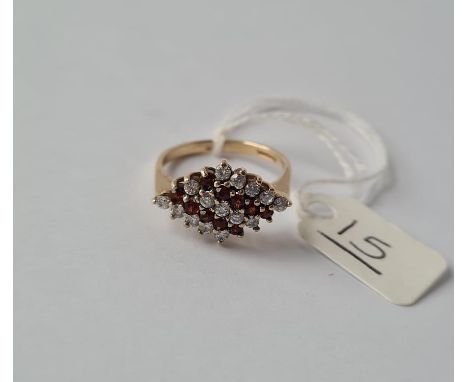 A C.Z. band ring with red &amp; white stones in 9ct - size O.5 - 3gms