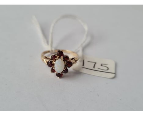 A hallmarked garnet &amp; opal ring in 9ct - size H - 1.6gms