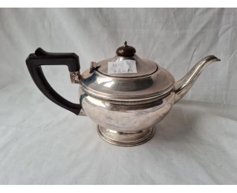 A circular teapot on rimmed foot Birmingham 1920 434 gms 