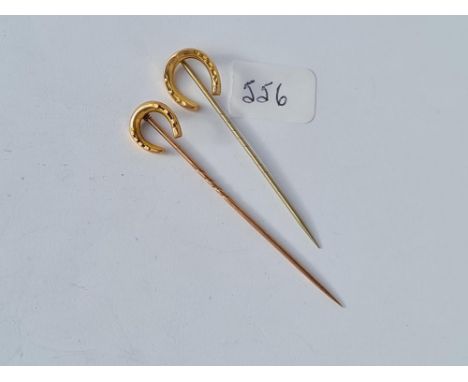 Two horseshoe topped stick pins - 1x 15ct gold - 1 x 9ct - 2.7gms 