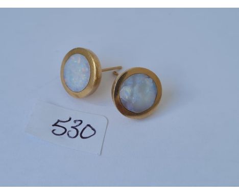 A pair of circular opal earrings in 9ct mounts 4.1g