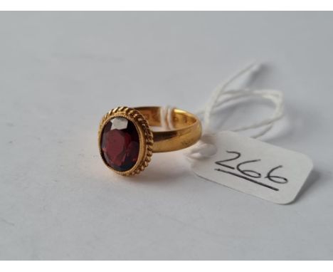 AN EDWARDING GARNET RING IN 22CT GOLD - size N - 6.5gms