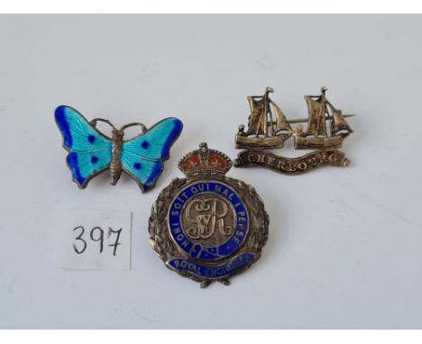 Three silver and enamel brooches 