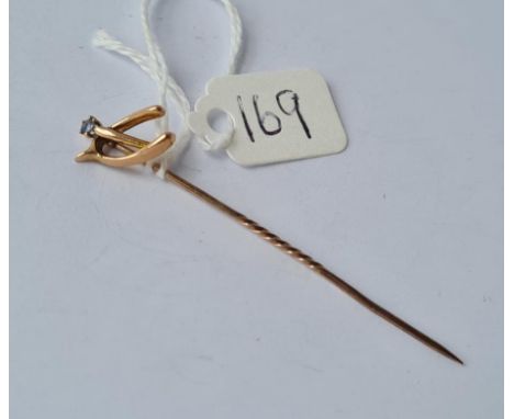 A wishbone &amp; sapphire set stick pin in 9ct 