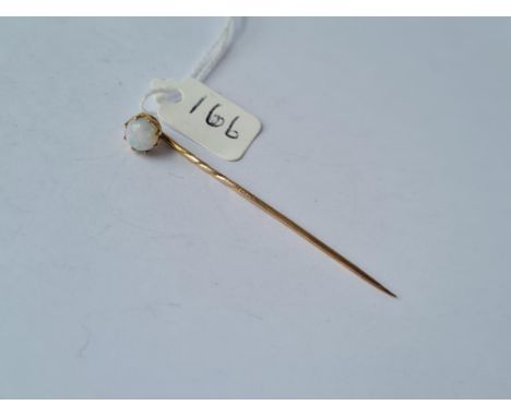 A high carat unmarked stick pin with large opal 