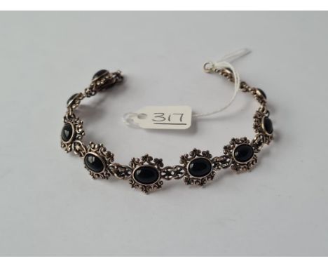 A silver &amp; onyx panel bracelet 