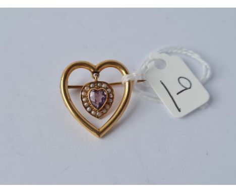 An Edwardian amethyst pearl heart brooch in 9ct 