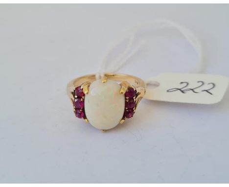 An opal and ruby 18ct gold dress ring size J 4.8g inc