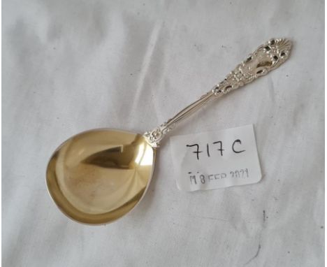 A decorative caddy spoon in sterling silver gilt bowl 