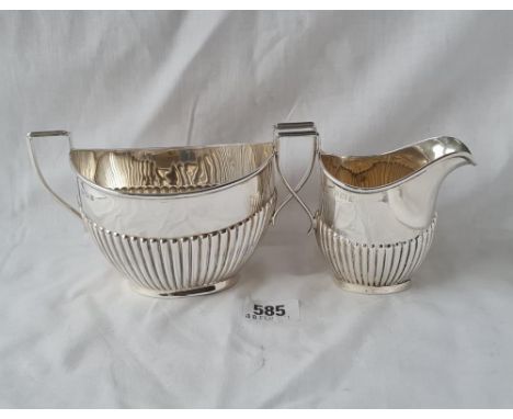 A good and half fluted cream jug and matching sugar basin 6 1/2 inches over handle, Birmingham 1912 by HYP 210 gms 