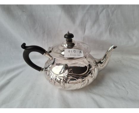 A embossed teapot of compressed form London 1905 by EED 255 gms 