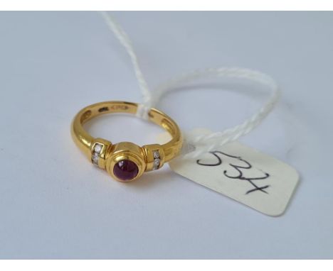 A cabochon ruby ring with diamond shoulders in 18ct gold size I 3g