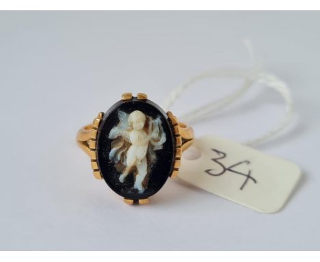 A gold and hardstone cherub ring size L 6.6g inc