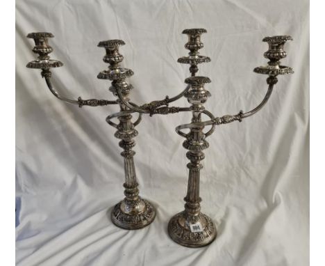 A good pair of old Sheffield three light candelabra with decorated rims 21 inches high 