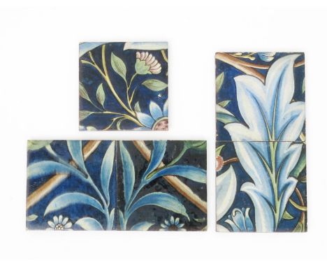 Five William De Morgan Membland Hall Poole Architectural tiles,  painted with flowers and foliage in shades of blue, green an