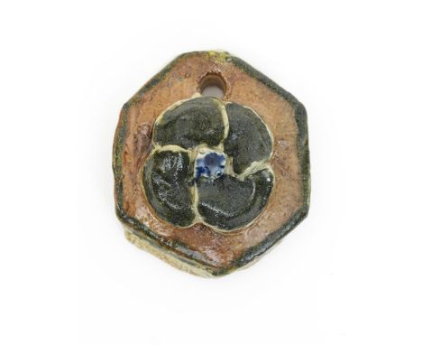 A rare Martin Brothers stoneware pendant by Robert Wallace Martin, dated 1876, applied with a simple flower head, in shades o