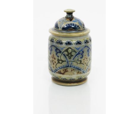 A Martin Brothers stoneware jar and cover by Robert Wallace Martin, dated 1879, incised with geometric decoration in shades o