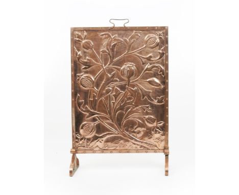 A Keswick School of Industrial Arts copper firescreen, rectangular form on scrolling triangular feet, repousse hammered in re