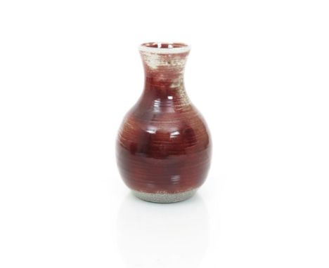 A Ruskin Pottery high-fired stoneware vase by William Howson Taylor, dated 1924, ovoid with waisted neck, covered in with a s