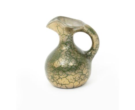 A Sunflower Pottery jug by Sir Edmund Elton, ovoid form, covered in a crackled glaze over lime green painted Elton mark, 13cm