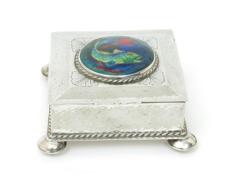 An electroplated box set with enamel roundel probably by The Guild of Handicrafts, square section on four bun feet, the hinge