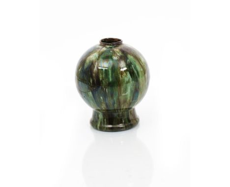 A rare Linthorpe Pottery vase designed by Dr Christopher Dresser, ovoid with cylindrical foot, covered in a running green and