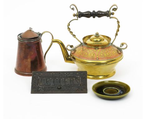 A Benham & Froud brass kettle  in the manner of Dr Christopher Dresser,  the shoulder inlaid with copper foliate design, ebon