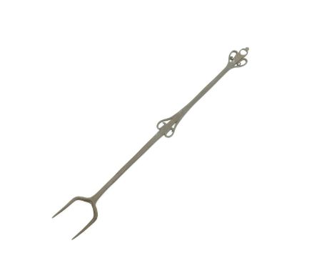 ‡ A Cotswold School wrought iron toasting fork, two pronged with heart motif to stem and terminal unsigned 54cm. long.