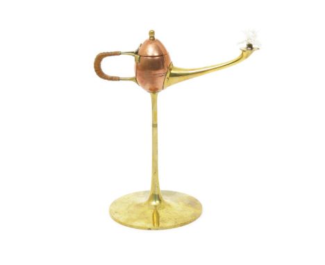 A copper and brass cigar lamp in the manner of Jan Eisenloeffel, probably W.M.F, unmarked 21cm. high Literature Modern Art of