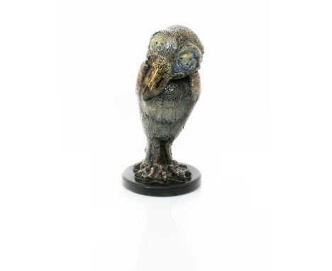 An early Martin Brothers stoneware bird jar and cover by Robert Wallace Martin, dated 1884, modelled slightly hunched with he