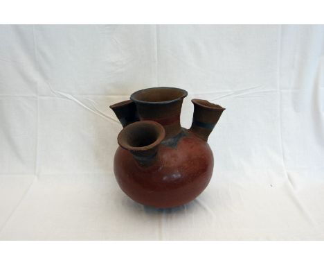 A terracotta planter with four apertures and bulbous lower section (af).  Est £15-30