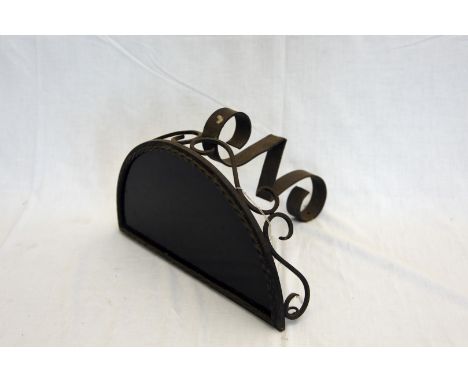 A demi-lune wrought iron scrolled wall shelf.  Est £10-20